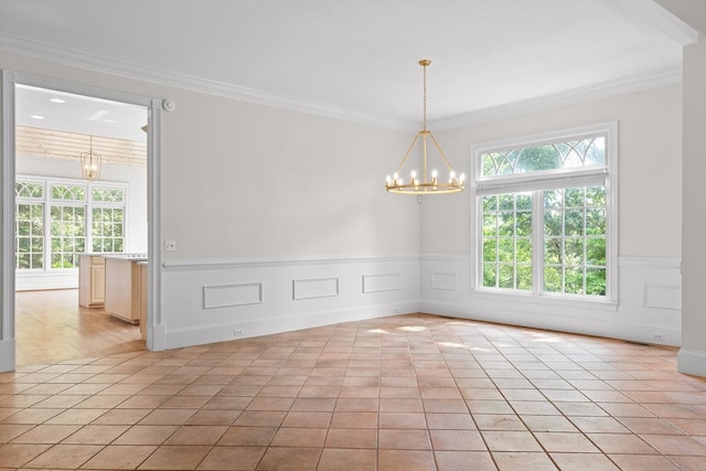 2001 Eagle Point Dr, Dalton, GA 30720 - unfurnished room featuring plenty of natural light, a chandelier, a wainscoted wall, ornamental molding, and light tile patterned floors