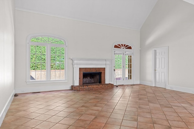 2001 Eagle Point Dr, Dalton, GA 30720 - unfurnished living room featuring light tile patterned flooring, a fireplace, high vaulted ceiling, and baseboards