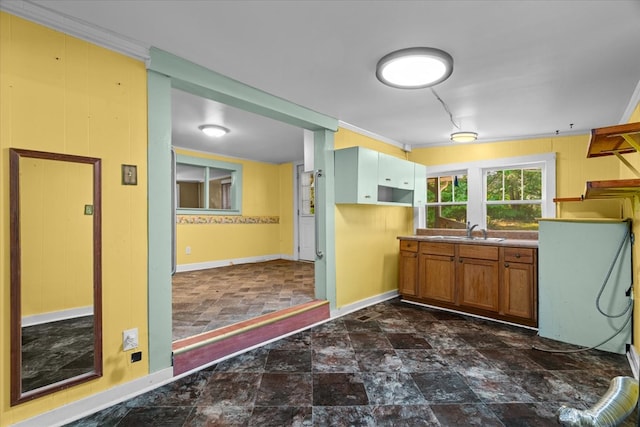 1098 Mount Vernon Rd, Tunnel Hill, GA 30755 - kitchen with a sink, stone finish floors, brown cabinetry, and baseboards