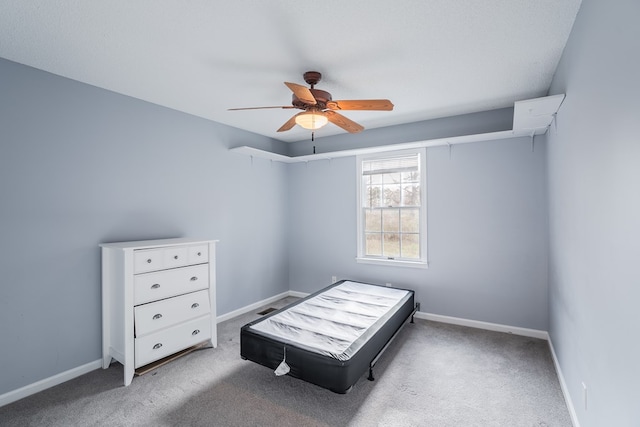 bedroom featuring baseboards, carpet floors, and ceiling fan