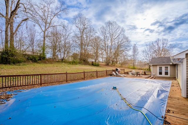 view of swimming pool with a wooden deck