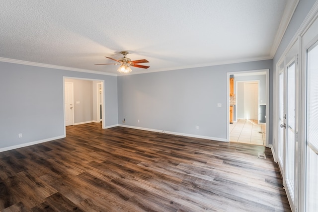 empty room with dark wood-type flooring, ceiling fan, crown molding, and a textured ceiling