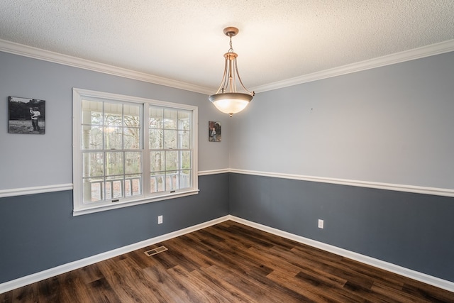 spare room featuring baseboards, dark wood-style flooring, and ornamental molding