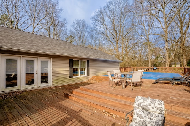 wooden deck featuring outdoor dining area and fence