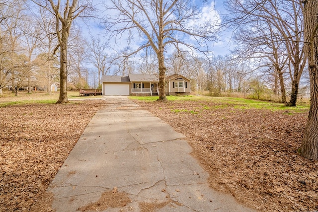 view of front of house featuring driveway and a garage