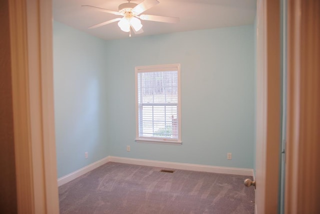 empty room with carpet floors and ceiling fan