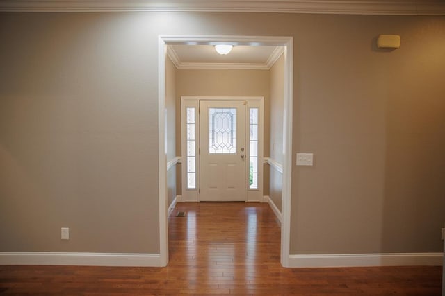 foyer entrance featuring wood-type flooring and ornamental molding