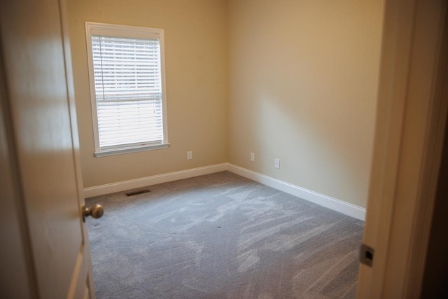 spare room featuring carpet flooring