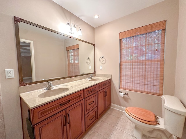 bathroom with vanity, tile patterned floors, and toilet