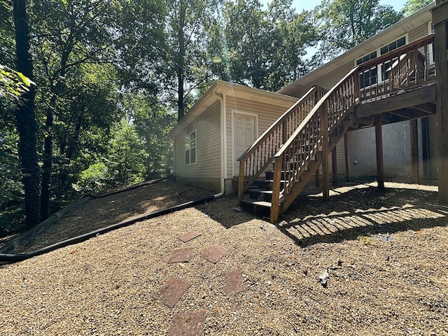 view of side of property with a wooden deck