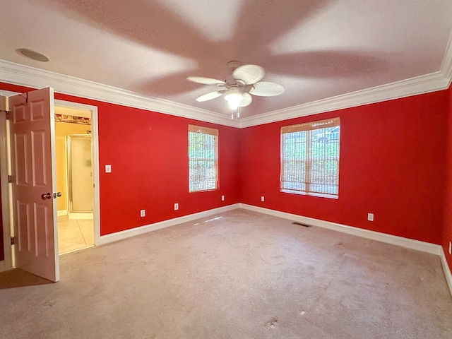 carpeted empty room featuring ornamental molding, a textured ceiling, and ceiling fan