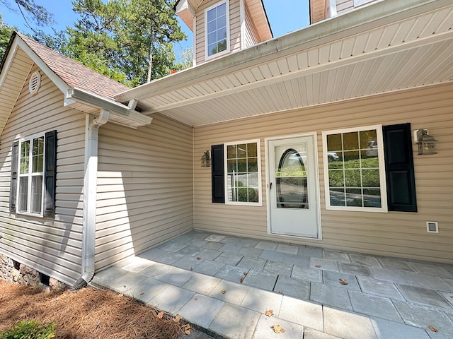 entrance to property with a patio