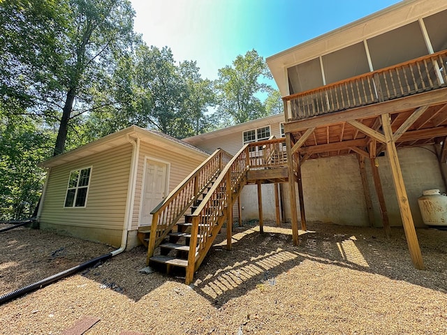 back of house featuring a deck