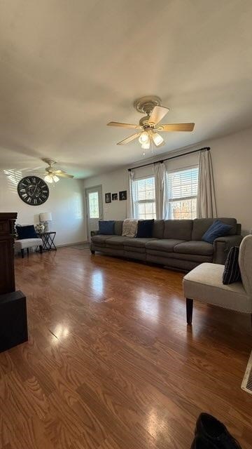 living room featuring ceiling fan and wood finished floors