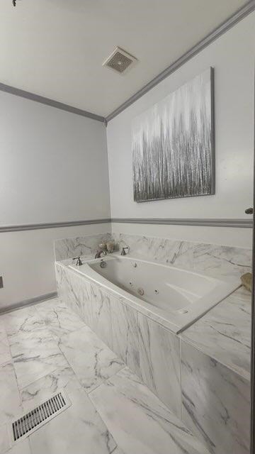 416 Old Cottonwood Mill Rd, Tunnel Hill, GA 30755 - full bathroom with visible vents, marble finish floor, a whirlpool tub, and ornamental molding