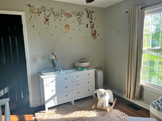 41 Magnolia Ct, Rydal, GA 30171 - bedroom with dark wood finished floors and a nursery area
