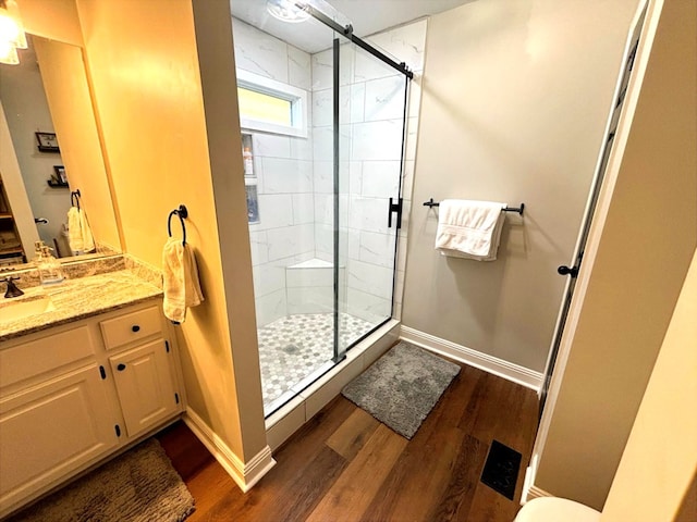 41 Magnolia Ct, Rydal, GA 30171 - bathroom featuring wood finished floors, a shower stall, and vanity