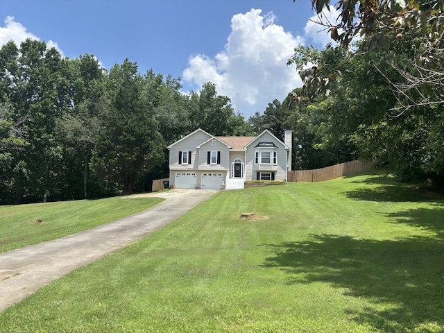 41 Magnolia Ct, Rydal, GA 30171 - bi-level home featuring a garage, a chimney, and driveway