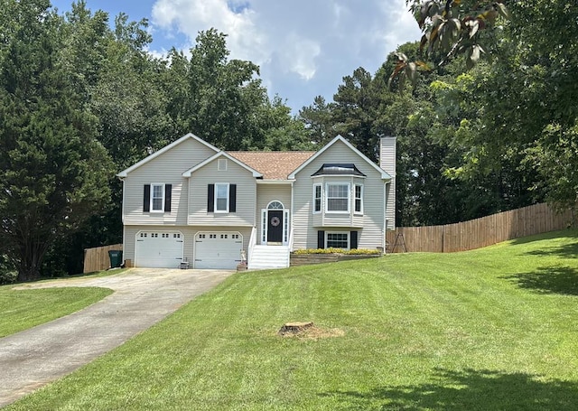 41 Magnolia Ct, Rydal, GA 30171 - split foyer home with a chimney, an attached garage, and driveway