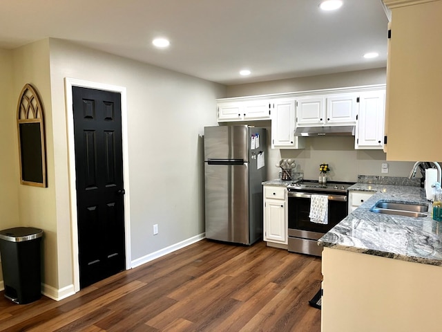 41 Magnolia Ct, Rydal, GA 30171 - kitchen with appliances with stainless steel finishes, dark wood-style flooring, light stone countertops, white cabinetry, and recessed lighting
