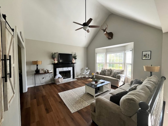 41 Magnolia Ct, Rydal, GA 30171 - living area featuring a barn door, ceiling fan, high vaulted ceiling, wood finished floors, and a fireplace