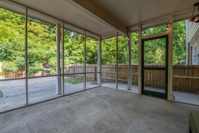 unfurnished sunroom with a wealth of natural light