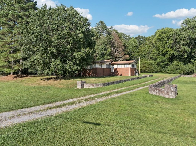 183 Long Hollow Rd, Rock Spring, GA 39736 - view of green lawn featuring a wooded view
