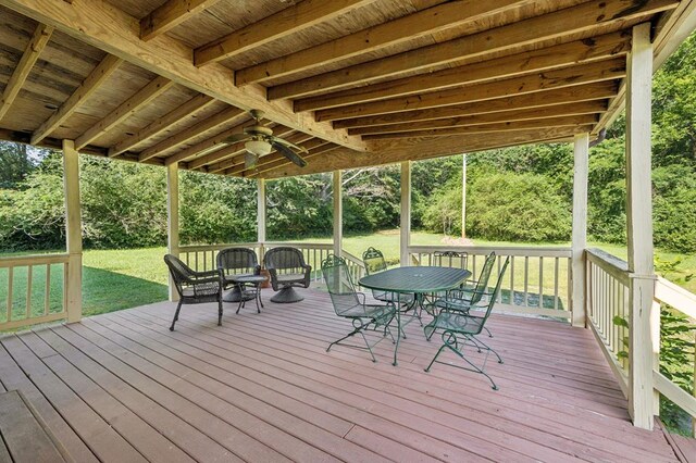 183 Long Hollow Rd, Rock Spring, GA 39736 - wooden terrace featuring outdoor dining space, a yard, and ceiling fan