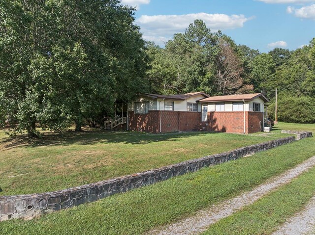183 Long Hollow Rd, Rock Spring, GA 39736 - view of side of property with brick siding and a yard