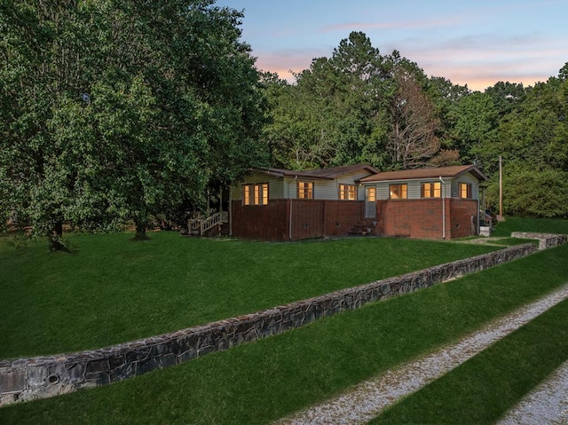 183 Long Hollow Rd, Rock Spring, GA 39736 - view of front facade with brick siding and a lawn