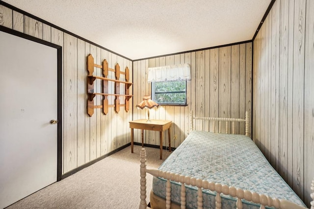 183 Long Hollow Rd, Rock Spring, GA 39736 - carpeted bedroom featuring a textured ceiling, ornamental molding, and wooden walls