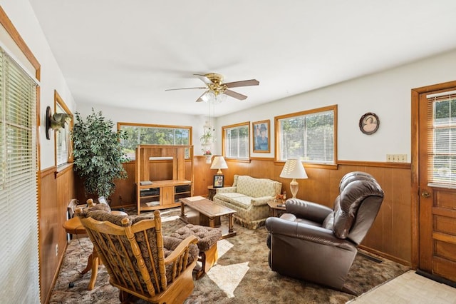 183 Long Hollow Rd, Rock Spring, GA 39736 - living area with a wainscoted wall, healthy amount of natural light, wood walls, and ceiling fan