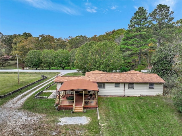 183 Long Hollow Rd, Rock Spring, GA 39736 - back of property with a deck, a lawn, and a forest view