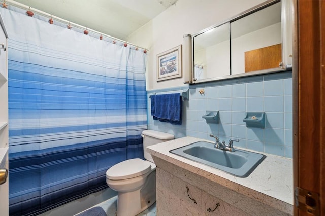 183 Long Hollow Rd, Rock Spring, GA 39736 - bathroom with vanity, a shower with shower curtain, tile walls, and backsplash