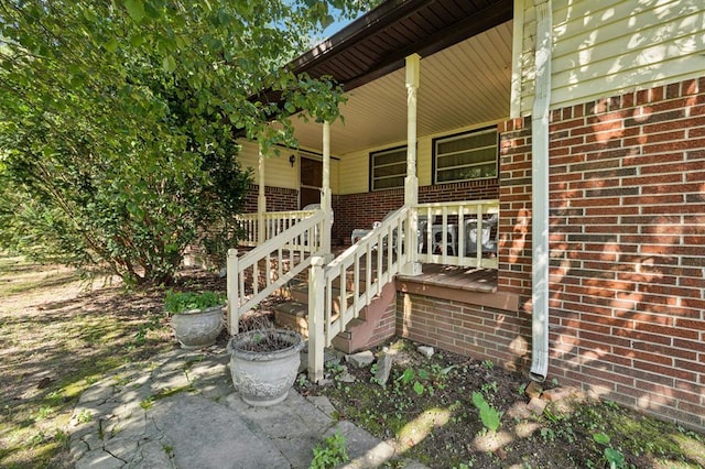 183 Long Hollow Rd, Rock Spring, GA 39736 - doorway to property featuring a porch and brick siding