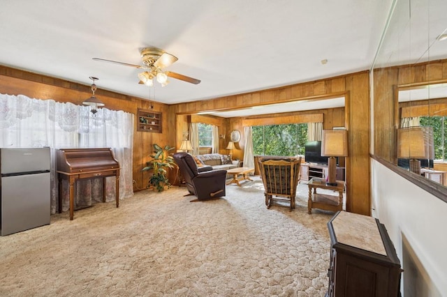 183 Long Hollow Rd, Rock Spring, GA 39736 - carpeted living area featuring wooden walls and ceiling fan