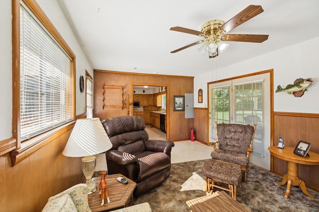 183 Long Hollow Rd, Rock Spring, GA 39736 - living area featuring wooden walls, a ceiling fan, and a wainscoted wall