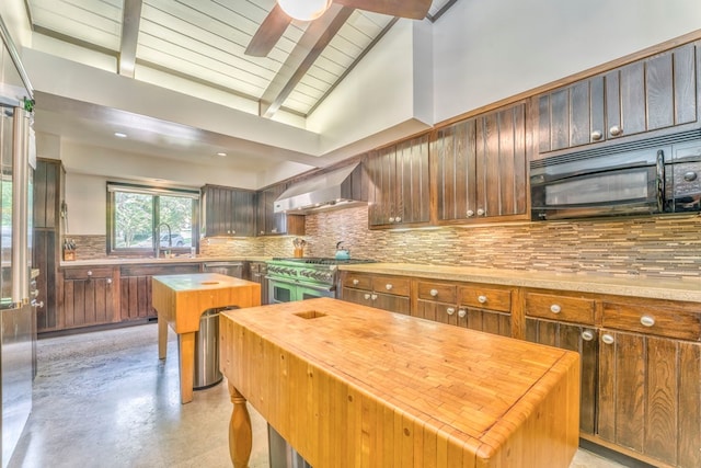 1301 Morton Dr, Dalton, GA 30720 - kitchen featuring wall chimney exhaust hood, stainless steel appliances, butcher block countertops, backsplash, and finished concrete floors