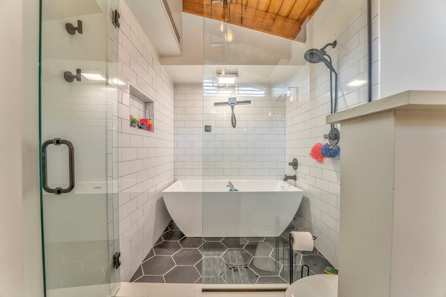 1301 Morton Dr, Dalton, GA 30720 - bathroom featuring tile walls, a stall shower, tile patterned floors, and a soaking tub