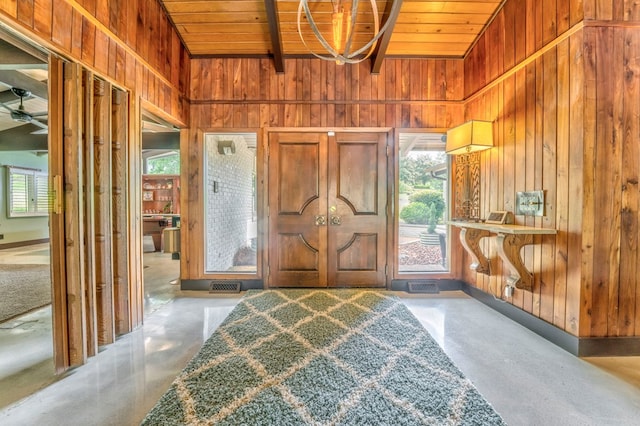 1301 Morton Dr, Dalton, GA 30720 - foyer entrance with wooden walls, finished concrete floors, wood ceiling, healthy amount of natural light, and vaulted ceiling