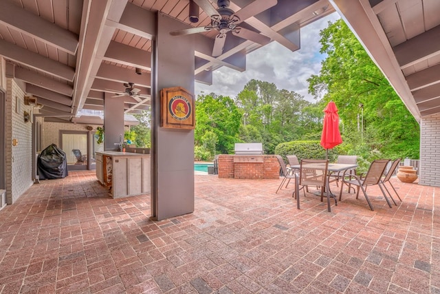 1301 Morton Dr, Dalton, GA 30720 - view of patio featuring exterior kitchen, a ceiling fan, outdoor dining space, area for grilling, and a sink