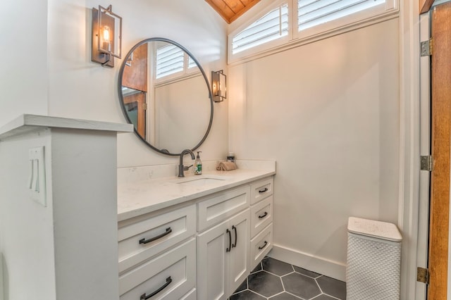 1301 Morton Dr, Dalton, GA 30720 - bathroom with lofted ceiling, tile patterned flooring, and vanity