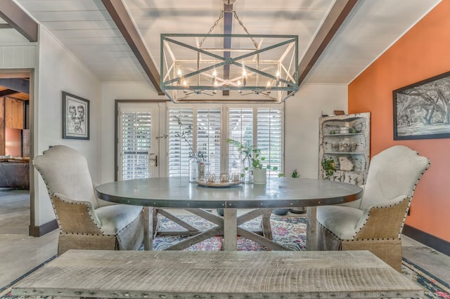 1301 Morton Dr, Dalton, GA 30720 - dining area featuring baseboards, a chandelier, and finished concrete floors