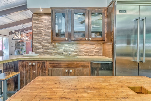 1301 Morton Dr, Dalton, GA 30720 - bar featuring built in refrigerator, a sink, and tasteful backsplash
