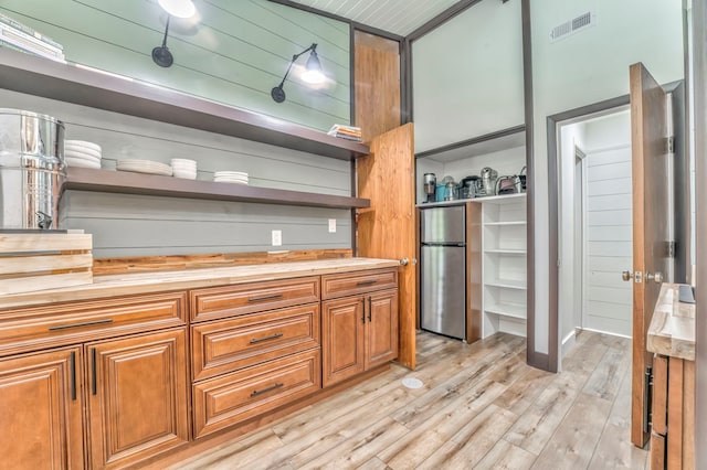 1301 Morton Dr, Dalton, GA 30720 - kitchen featuring open shelves, wood counters, freestanding refrigerator, light wood-type flooring, and brown cabinetry