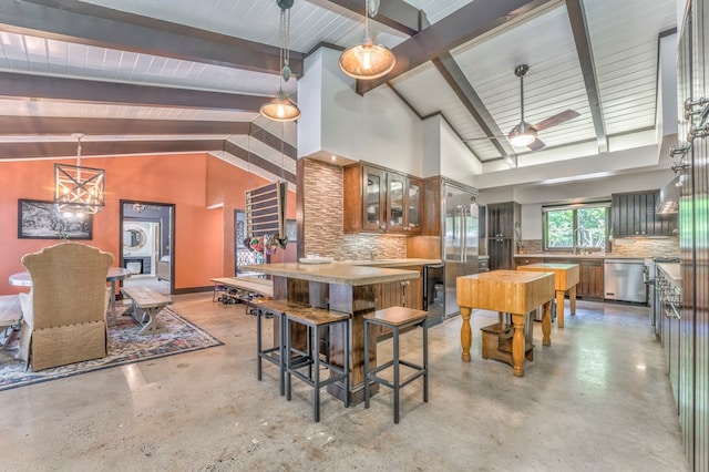 1301 Morton Dr, Dalton, GA 30720 - kitchen with stainless steel dishwasher, decorative backsplash, concrete floors, brown cabinets, and beamed ceiling