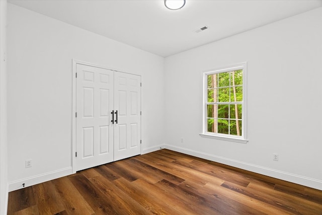 3005 Crystal Mark Ln, Dalton, GA 30721 - unfurnished bedroom featuring dark wood-style flooring and a closet