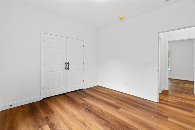 3005 Crystal Mark Ln, Dalton, GA 30721 - unfurnished bedroom with wood finished floors and baseboards