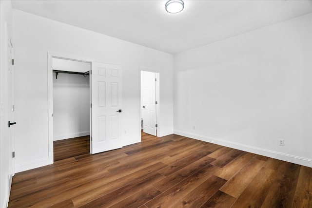 3005 Crystal Mark Ln, Dalton, GA 30721 - unfurnished bedroom with wood finished floors, a walk in closet, and a closet