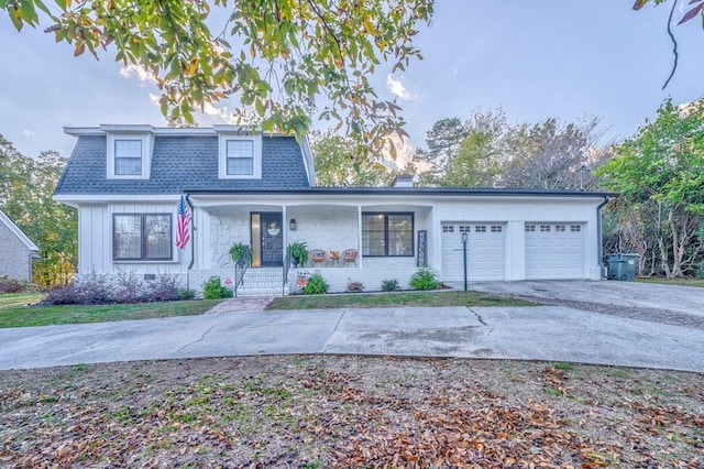 view of front property with a garage and covered porch